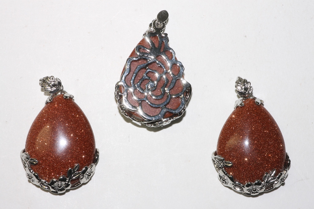 3pcs. Gold sandstone synthetic teardrop pendant decorated