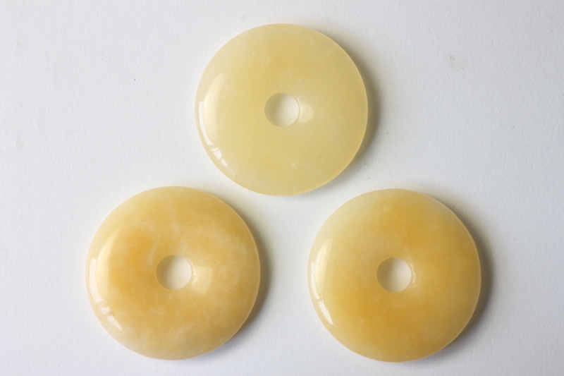 Set of 3 aragonite, yellow 40mm donuts