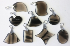 Set of 20 lamellar obsidian pendants
